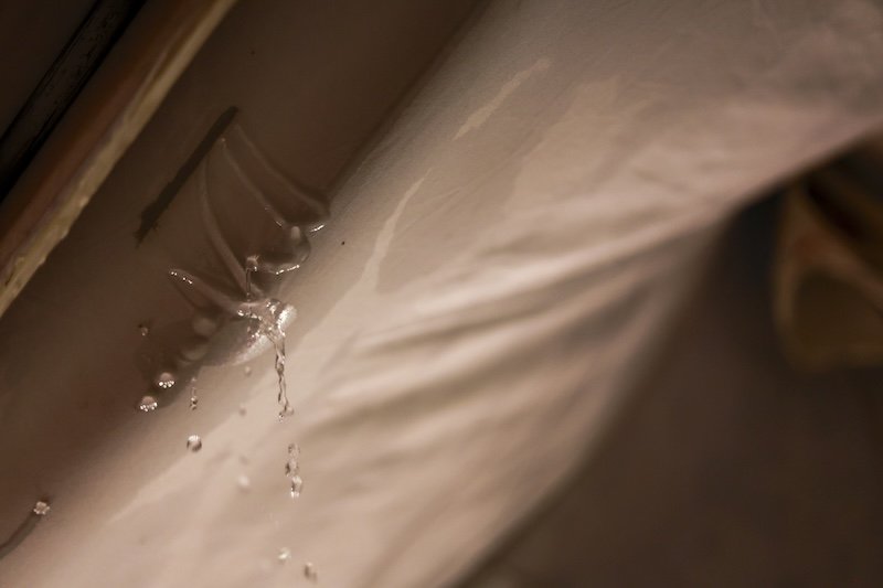 Serious water leak from burst plumbing pipe causing property damage inside home. This household problem requires emergency repair to prevent flood or disaster