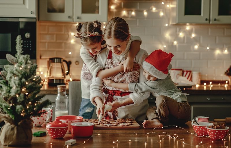 happy funny family mother and children  bake christmas cookies