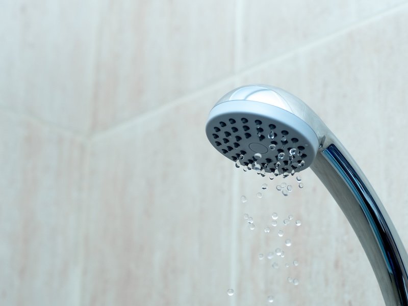 Shower head with low water stream. Broken shower in the bashroom