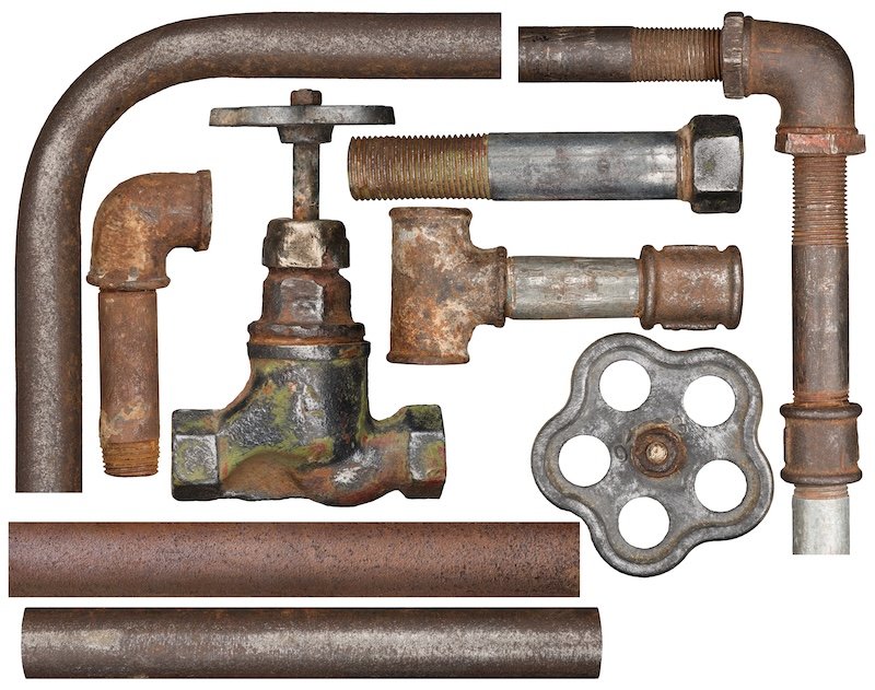 Old valve ant rusty pipes isolated on white