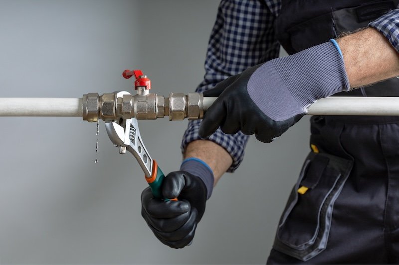 plumber fix leaking pipe at home.