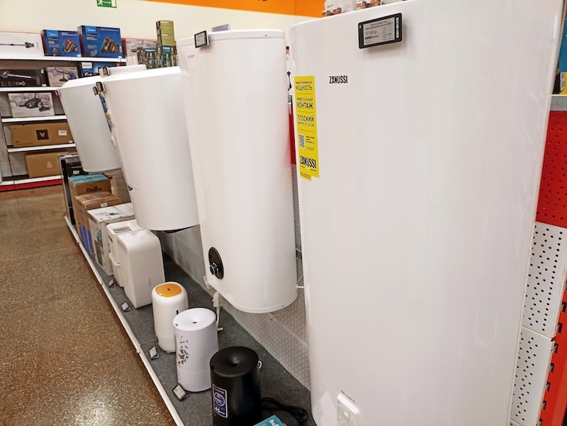 Home appliance store display with water heaters and boilers.
