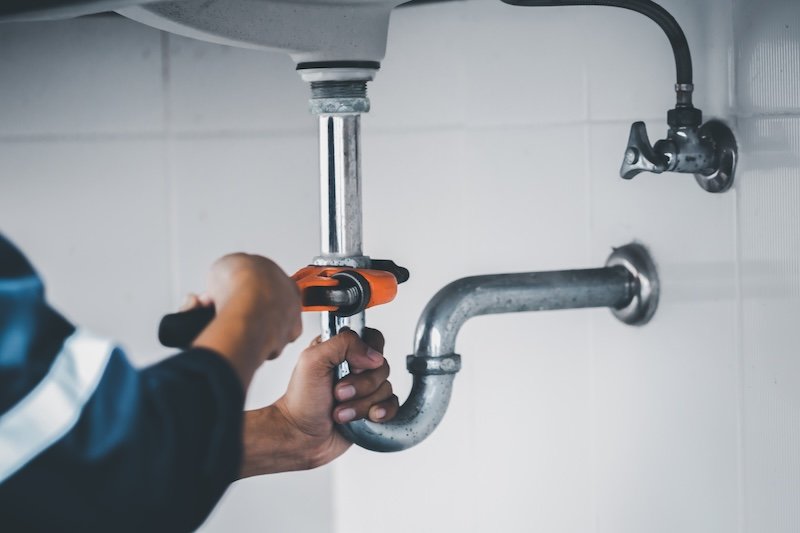 plumber at work in a bathroom, plumbing repair service, assemble and install concept. Best plumber in meridian, Idaho