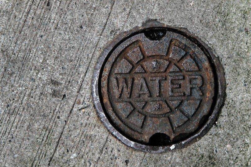 A water main manhole cover. water line repair or replace
